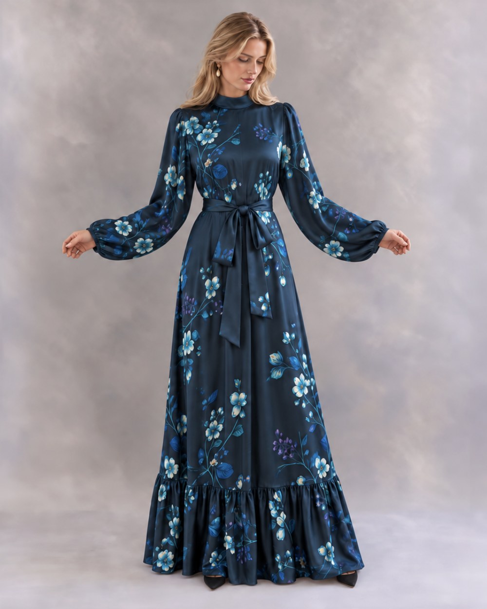 The Virgie Dress in navy blue, full length, with the waist sash tied